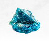 A captivating image of a blue apatite crystal chunk, exhibiting a stunning sky-blue hue. The crystal's translucent nature allows light to pass through, creating a sense of ethereal beauty and tranquility.