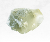 A captivating image of a green amethyst (prasiolite) crystal chunk, displaying a serene green color with a transparent and polished surface. The crystal's gentle hues evoke a sense of tranquility and renewal, radiating a soothing energy.