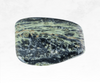 An image of a Kambaba Jasper crystal chunk, exhibiting its deep green colour with intricate patterns resembling a lush forest. The stone's unique texture and earthy tones evoke a connection to nature.