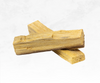 An image of Palo Santo, a sacred wood used for spiritual cleansing. The photograph showcases a bundle or individual sticks of Palo Santo, featuring a warm, reddish-brown color and a distinct aromatic scent. This natural tool is believed to purify energies, promote relaxation, and invite positive vibrations.